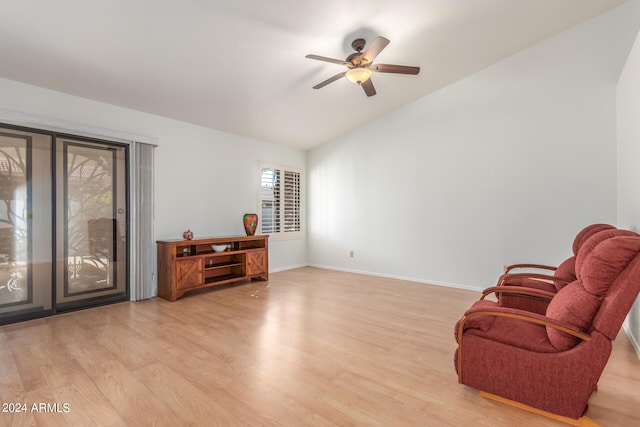 sitting room featuring vaulted ceiling, light hardwood / wood-style floors, and ceiling fan