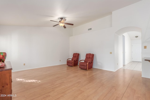 sitting room with ceiling fan and light hardwood / wood-style floors