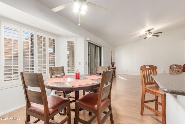 dining area with ceiling fan and light hardwood / wood-style floors