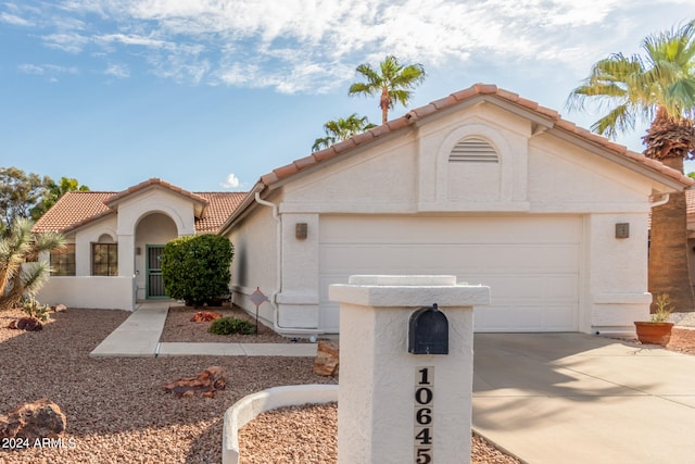 view of front of property with a garage