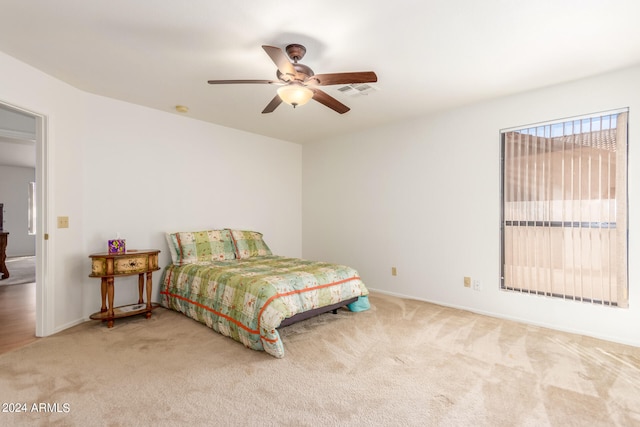 bedroom featuring ceiling fan and carpet flooring