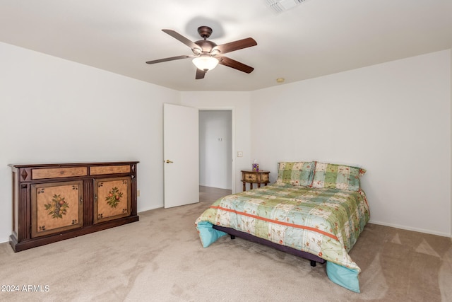 bedroom featuring ceiling fan and light colored carpet