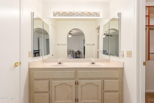 bathroom featuring ceiling fan and vanity