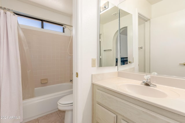 full bathroom featuring vanity, tile patterned flooring, toilet, and shower / bathtub combination with curtain