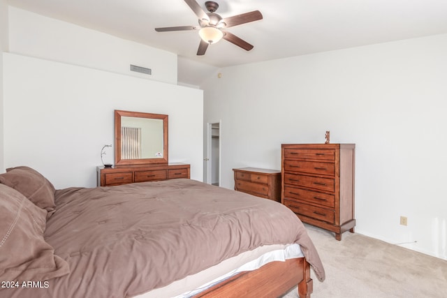 carpeted bedroom featuring ceiling fan and lofted ceiling