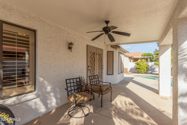 view of patio featuring ceiling fan