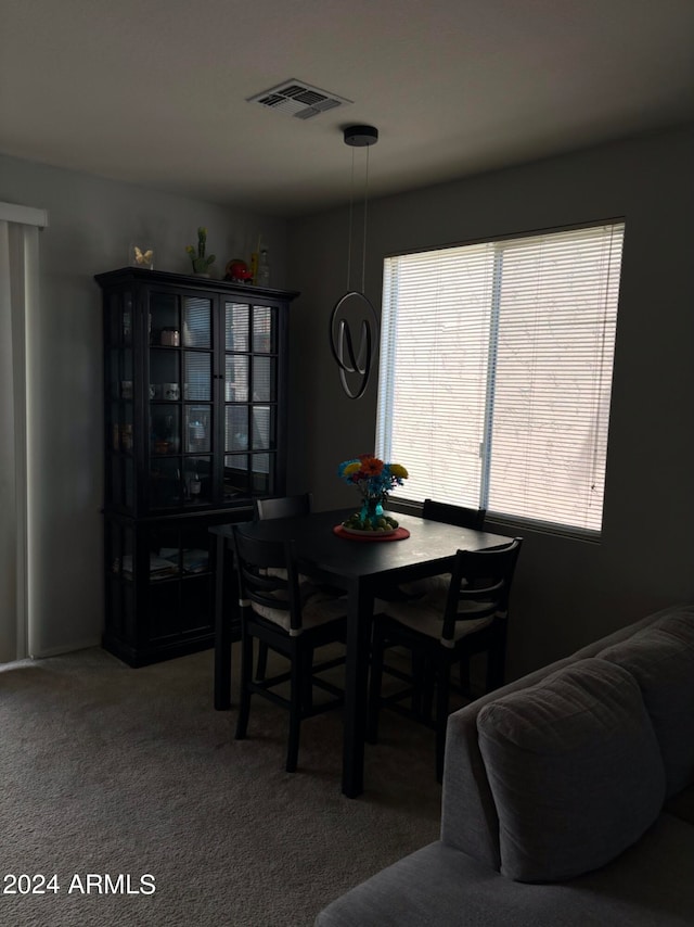 dining space featuring carpet