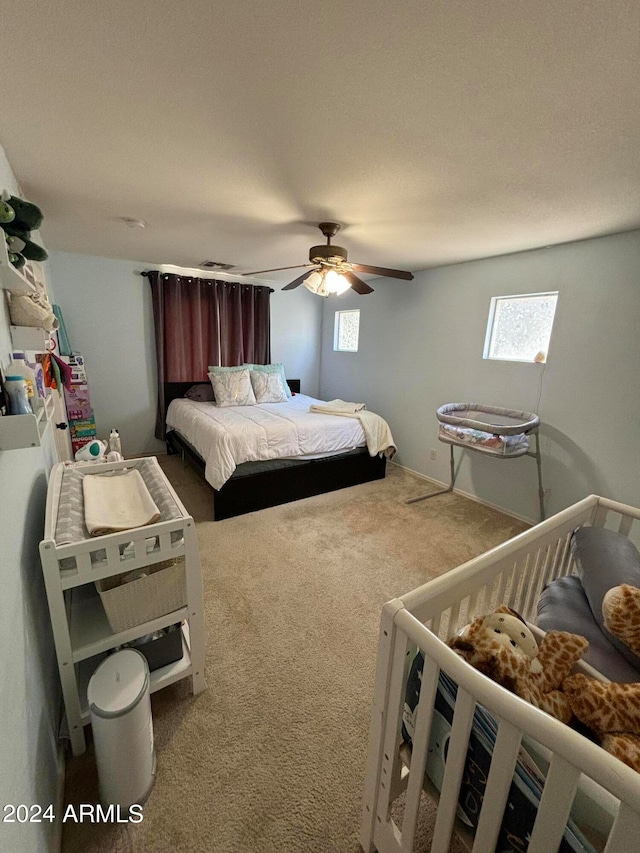 carpeted bedroom featuring ceiling fan