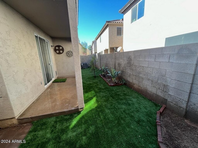 view of yard featuring central air condition unit