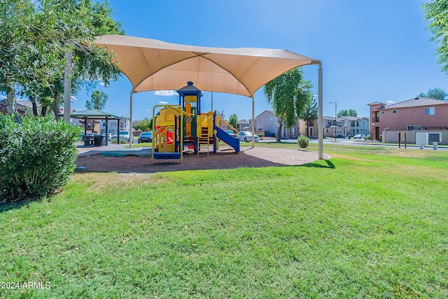 view of playground featuring a lawn