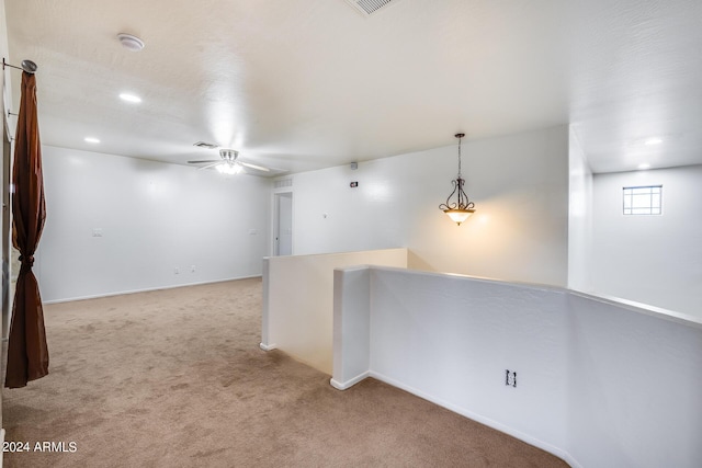 unfurnished room featuring carpet floors and ceiling fan