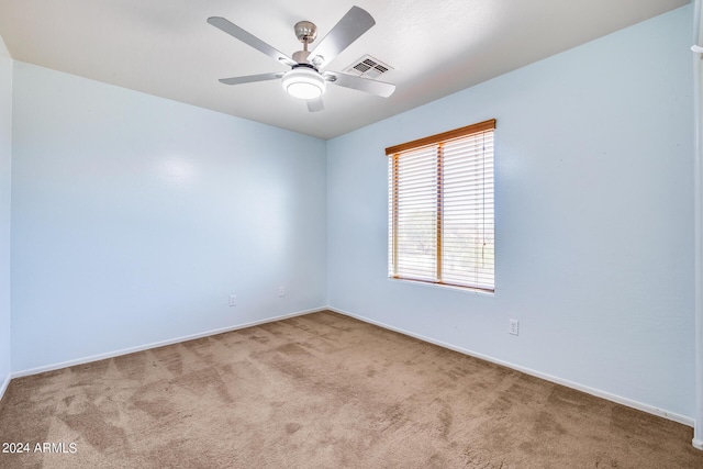 carpeted empty room with ceiling fan