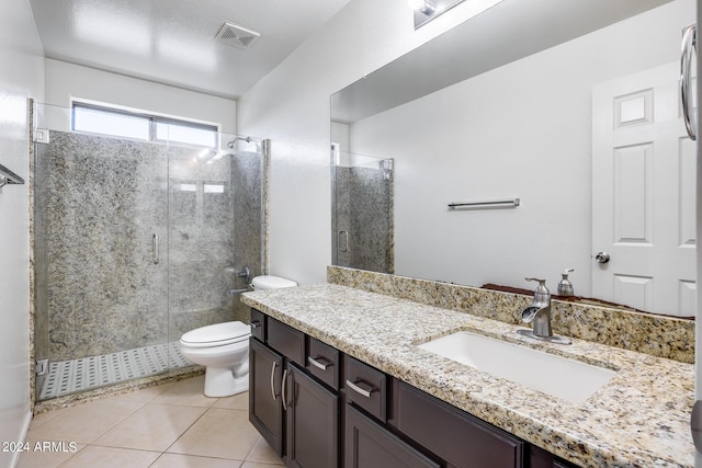 bathroom with walk in shower, vanity, toilet, and tile patterned flooring