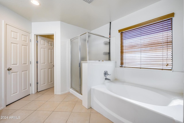 bathroom with plus walk in shower and tile patterned flooring