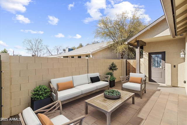 view of patio with outdoor lounge area and a fenced backyard