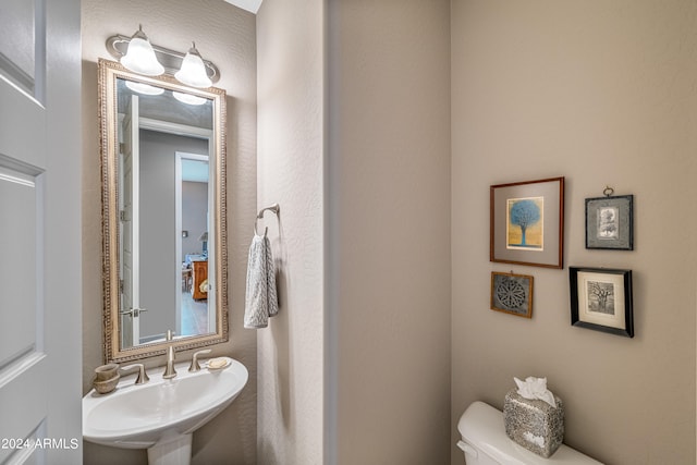 bathroom with sink and toilet