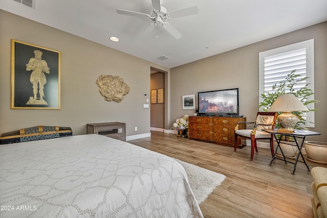 bedroom featuring light wood-type flooring and ceiling fan