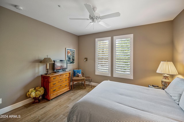 bedroom featuring light wood-type flooring and ceiling fan