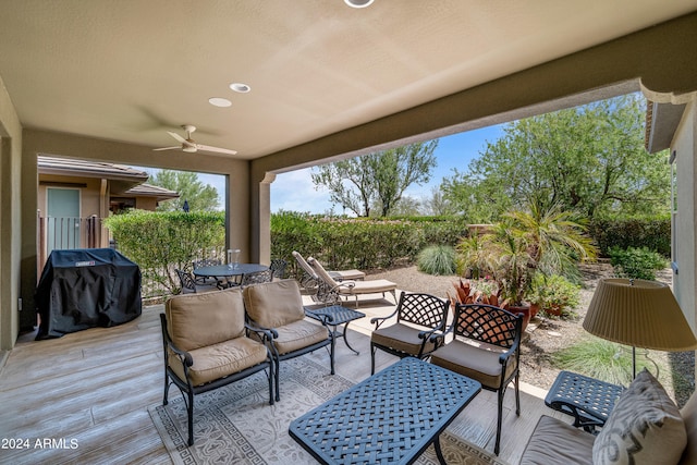 view of patio / terrace with outdoor lounge area, a grill, and ceiling fan