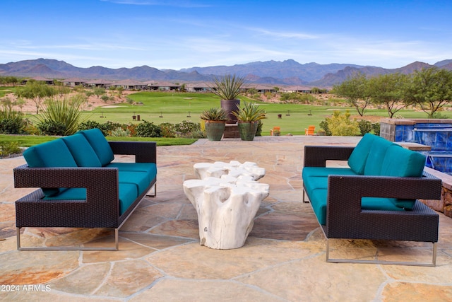 view of patio with a mountain view and an outdoor living space