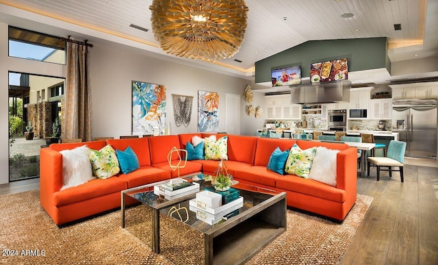 living room with hardwood / wood-style flooring, wooden ceiling, a towering ceiling, and an inviting chandelier