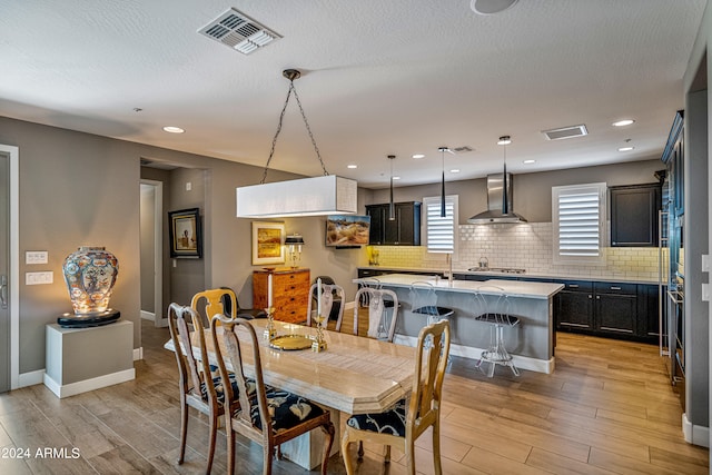 dining area with light hardwood / wood-style floors