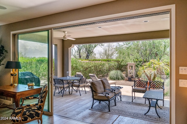 exterior space featuring hardwood / wood-style flooring and ceiling fan