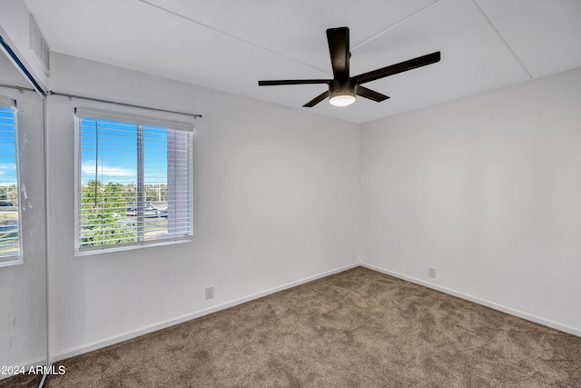 carpeted empty room with ceiling fan