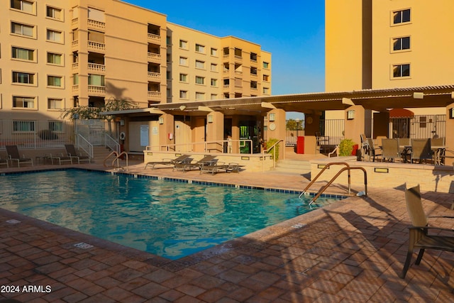 view of swimming pool featuring a patio