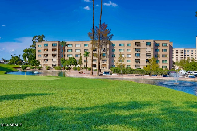 view of building exterior with a water view