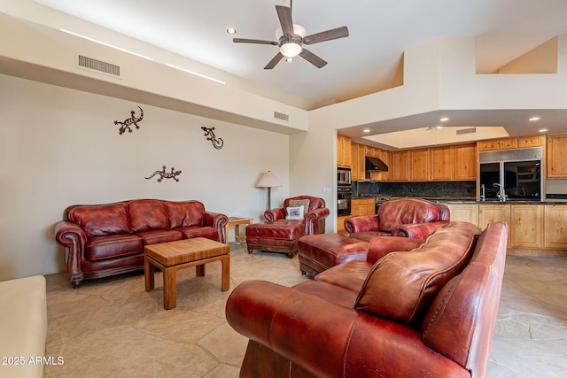 living room featuring visible vents, a ceiling fan, and recessed lighting