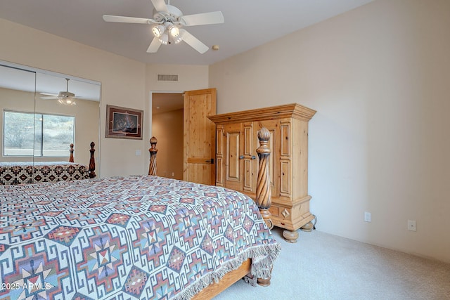 bedroom with carpet floors, a closet, visible vents, and a ceiling fan