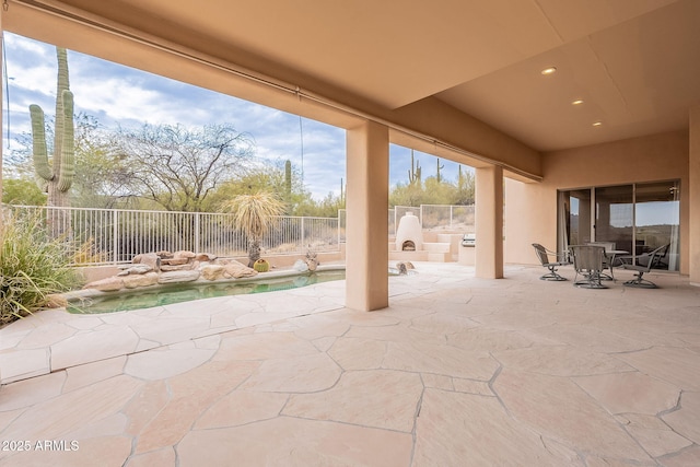 view of patio featuring a fenced backyard, outdoor dining area, and a fenced in pool