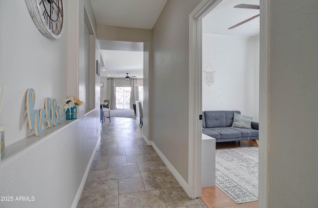 10402 E Javelina Ave, Mesa, AZ 85209 - hallway featuring baseboards and light stone finish flooring