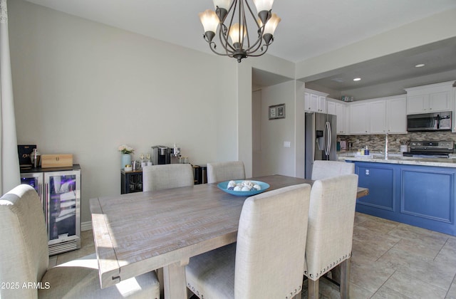 10402 E Javelina Ave, Mesa, AZ 85209 - dining room with a chandelier, beverage cooler, and recessed lighting