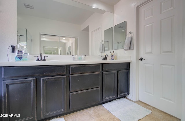 10402 E Javelina Ave, Mesa, AZ 85209 - bathroom featuring double vanity, tile patterned flooring, and a shower