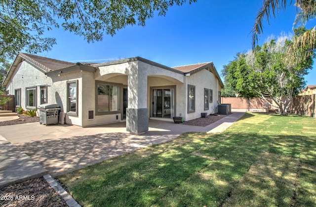 10402 E Javelina Ave, Mesa, AZ 85209 - back of property featuring stucco siding, a patio, and central AC