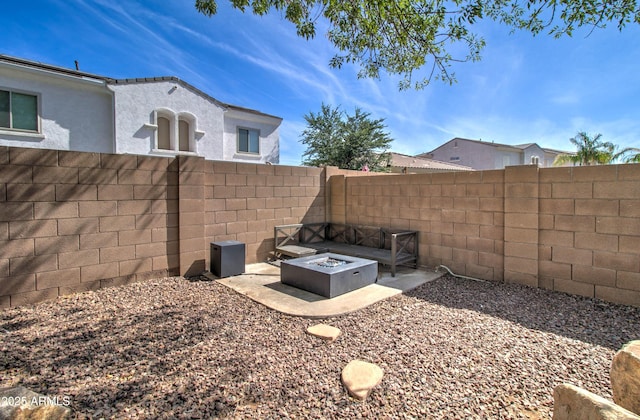 10402 E Javelina Ave, Mesa, AZ 85209 - fenced backyard featuring an outdoor fire pit and a patio