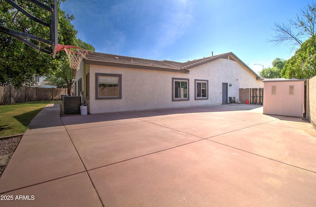 10402 E Javelina Ave, Mesa, AZ 85209 - back of house with stucco siding, a fenced backyard, a patio, and central AC unit