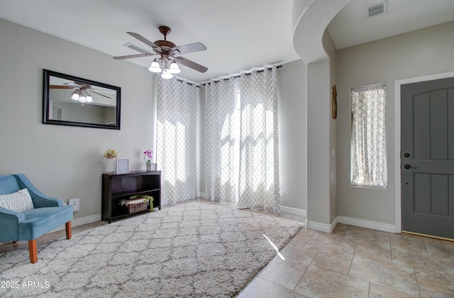 10402 E Javelina Ave, Mesa, AZ 85209 - entryway with plenty of natural light, a ceiling fan, and baseboards