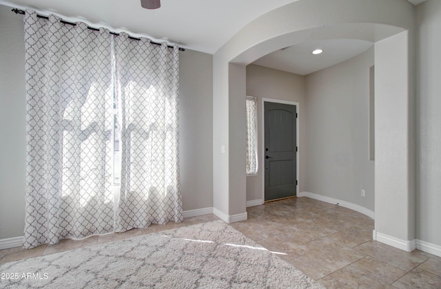 10402 E Javelina Ave, Mesa, AZ 85209 - entrance foyer featuring arched walkways, baseboards, and ceiling fan