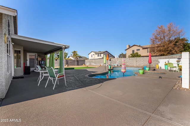 exterior space featuring a fenced backyard, a fenced in pool, and a patio