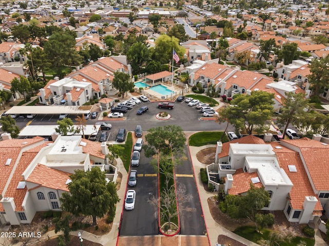 birds eye view of property with a residential view