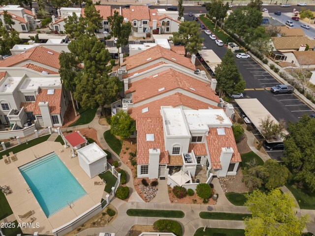 birds eye view of property with a residential view