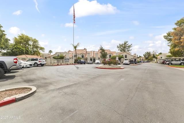 uncovered parking lot featuring a residential view