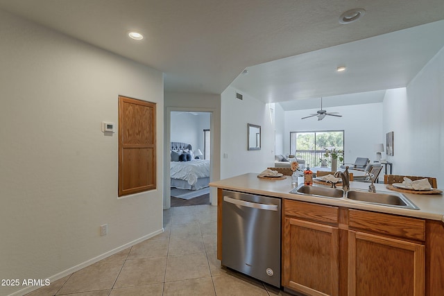 205 N 74th St Unit 261, Mesa, AZ 85207 - kitchen with stainless steel dishwasher, light countertops, a ceiling fan, light tile patterned floors, and brown cabinets