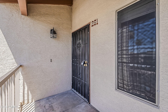 205 N 74th St Unit 261, Mesa, AZ 85207 - view of exterior entry featuring stucco siding and a balcony