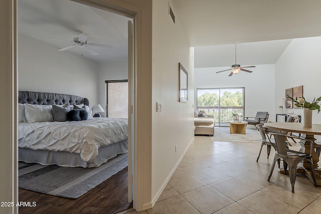205 N 74th St Unit 261, Mesa, AZ 85207 - bedroom with a high ceiling, access to exterior, light tile patterned floors, and a ceiling fan