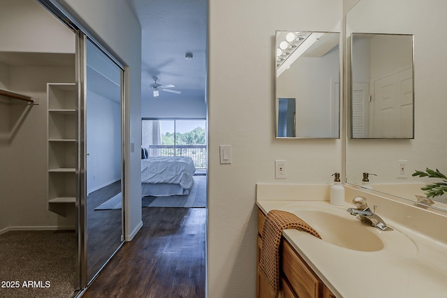 205 N 74th St Unit 261, Mesa, AZ 85207 - bathroom with vanity, ceiling fan, ensuite bath, wood finished floors, and a closet