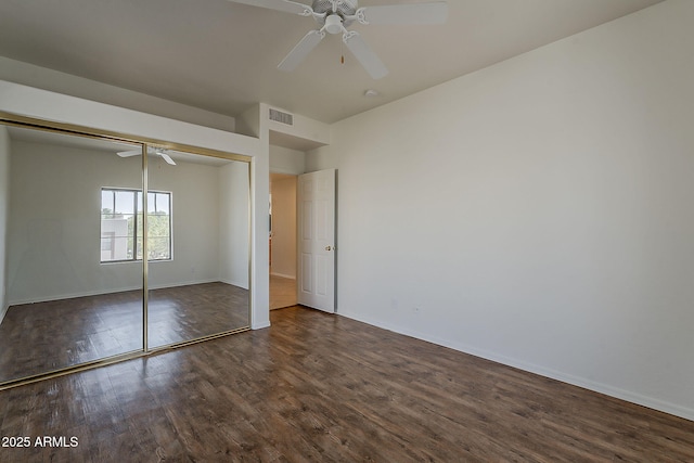 205 N 74th St Unit 261, Mesa, AZ 85207 - unfurnished bedroom with dark wood-type flooring, a closet, and a ceiling fan